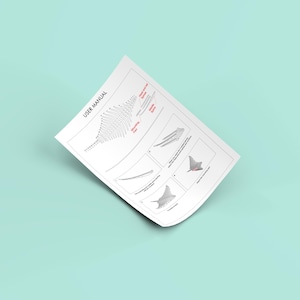 May include: A black and white user manual with the title "USER MANUAL" at the top of the page. The manual includes a diagram of a wing shape with different angles and a series of diagrams of a manta ray.