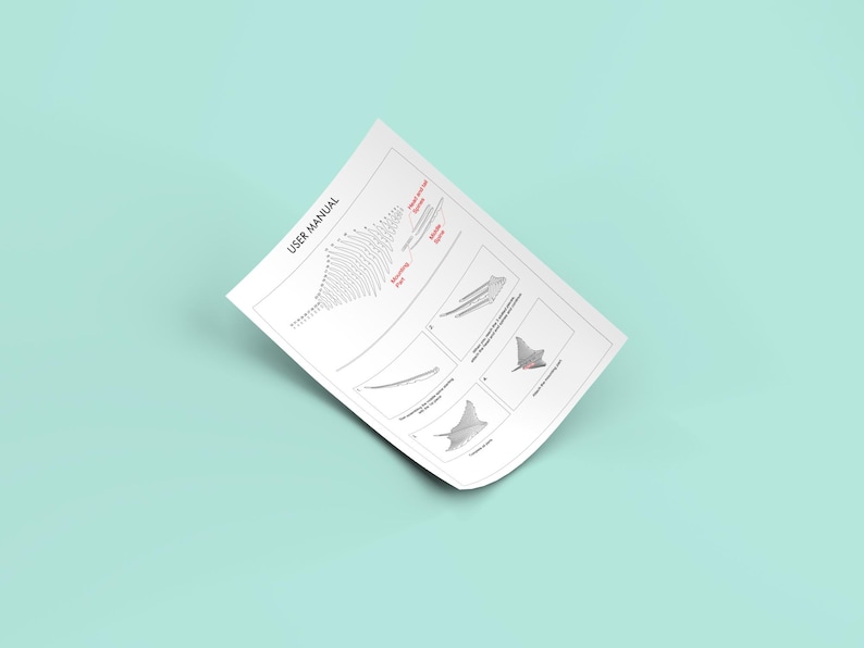 May include: A black and white user manual with the title "USER MANUAL" at the top of the page. The manual includes a diagram of a wing shape with different angles and a series of diagrams of a manta ray.