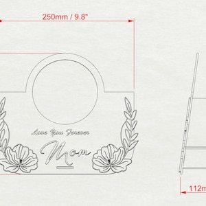 May include: A laser-cut wooden sign with the word "Mom" and the phrase "Love You Forever". The sign has a circular opening and floral and leaf accents. Dimensions are 9.8" wide, 8.7" high, and 4.4" deep.
