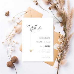 Minimalistic and elegant “We Still Do” wedding anniversary invitation with modern handwritten typography in black and white. This digital download can be used as an evite, phone text invitation, or printable card for a vow renewal, golden wedding, silver anniversary, or bronze celebration. The simple and timeless layout creates a sophisticated atmosphere for couples celebrating lasting love with style and grace.