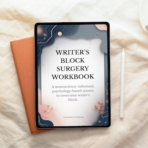 May include: A digital tablet displaying the cover of a workbook titled "WRITER'S BLOCK SURGERY WORKBOOK." The cover features a navy and blush design with gold accents. A stylus and an orange notebook are also visible.