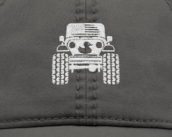 May include: Distressed charcoal gray baseball cap featuring a white graphic of a jeep with an American flag design. The cap has a pre-curved bill and a worn, vintage look.
