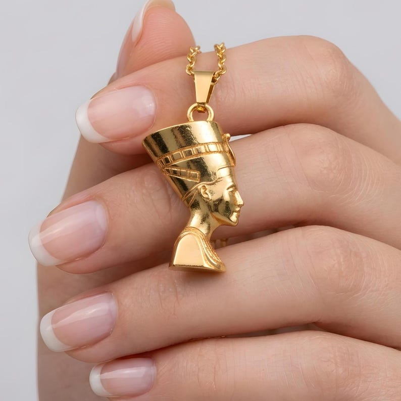 Handmade Nefertiti necklace in a brilliant polished shiny gold finish. A 24K gold plated Egyptian queen necklace for women, designed as a luxury anniversary gift for her. This shining gold necklace for mom is a standout piece of spiritual jewelry, ideal for special occasions and meaningful gifting.