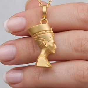 Handmade Nefertiti necklace in a sophisticated matte gold finish. This 24K gold plated ancient Egyptian necklace for women makes a unique anniversary gift for her. The detailed queen Nefertiti bust is a meaningful spiritual gift for mom, perfect for everyday elegance and boho style lovers.