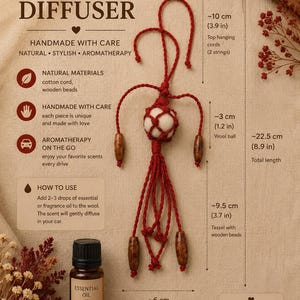 May include: A red macrame car diffuser featuring a central white wool ball, wooden beads, and a tassel. The total length is 22.5 cm, with a 10 cm hanging cord and a 9.5 cm tassel. It includes a 10 ml bottle of essential oil for aromatherapy.