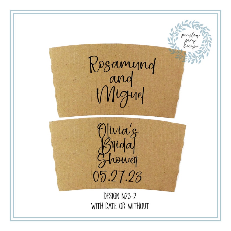 May include: Two brown cardboard coffee cup sleeves with black text. The top sleeve reads "Rosamund and Miguel." The bottom sleeve says "Olivia's Bridal Shower 05.27.23." The design is labeled "DESIGN N23-2 WITH DATE OR WITHOUT."