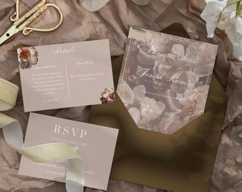 May include: A wedding invitation suite with a floral design. The invitation features a watercolor floral pattern in shades of pink and brown. The text on the invitation reads "Vanessa Sells and Joseph Ramos invite you to celebrate their union". The RSVP card is a light brown color with the text "RSVP" in white.