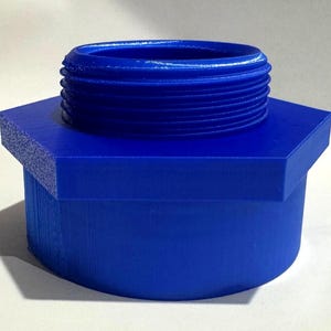 May include: A blue plastic adapter with a hexagonal base and a threaded top.