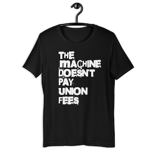 The Machine Doesn’t Pay Union Fees – Pro-Worker Tee,strike support merch, vintage union shirt, workers rights design, anti-corporate gift.
