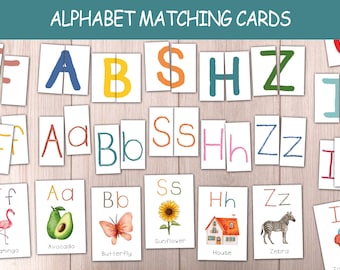 May include: Alphabet matching cards with uppercase and lowercase letters. Each card features a letter and a corresponding image, such as a flamingo, avocado, butterfly, sunflower, house, and zebra. The text "ALPHABET MATCHING CARDS" is at the top.