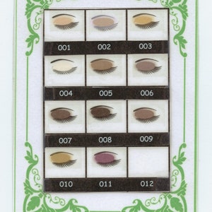May include: A chart with 12 eyeshadow swatches, each labeled with a number from 001 to 012. The swatches range in color from light beige to dark brown and include a purple shade.