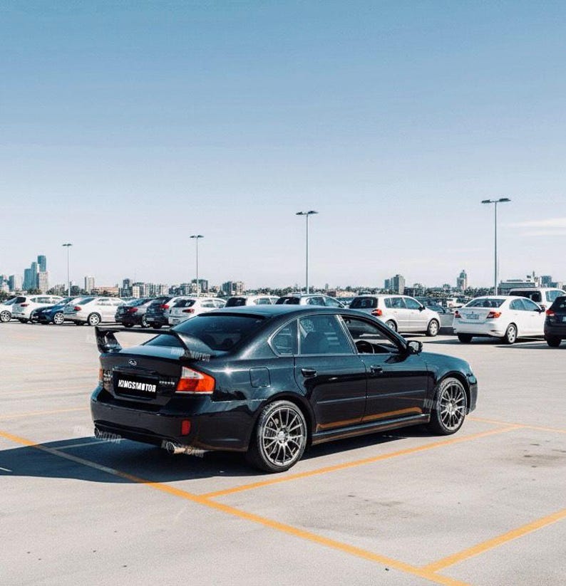Subaru Legacy rear spoiler 2003–2013, Glossy Black finish, shipped worldwide with tracking, delivery time may vary by customs