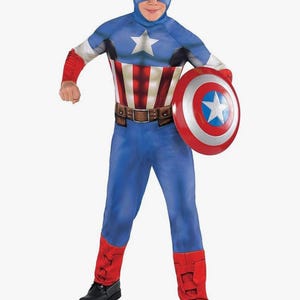 May include: A blue Captain America costume with a matching mask, a white star on the chest, and a red, white, and blue shield. The costume includes a brown belt, red accents, and black boots.