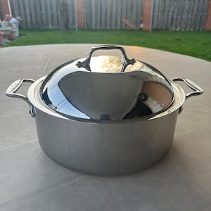 All-Clad Metalcrafters 3 Ply 8 Bonded Qt Stock Pot W/Lid With Stainless Interior, blemish on exterior but brand new