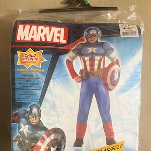 May include: A packaged Captain America child's costume. The costume includes a hooded half-mask, belt, and quilted muscle bodysuit. The packaging features the Marvel logo and an image of Captain America holding his shield.