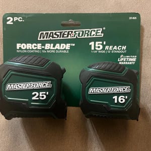 May include: Two Master Force Force-Blade tape measures with nylon coating. The tape measures are green and black with white text. The larger tape measure is 25 feet long and the smaller tape measure is 16 feet long. Both tape measures have a 15-foot reach and are 1-1/4 inches wide.