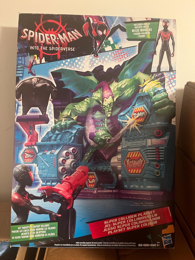 May include: A Spider-Man Into the Spider-Verse Super Collider Playset box. The box features illustrations of Spider-Man, Miles Morales, and the Green Goblin. The playset includes a Miles Morales figure and targets to defeat villains.
