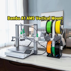 May include: A silver 3D printer with a black screen and a vertical mount holding multiple spools of filament in green, yellow, orange, and black. The text "Bambu A1 AMS Vertical Mount" is displayed in yellow.