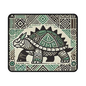 May include: A green and black patterned turtle with a tribal design. The turtle is walking on a white background with a green and black patterned border.