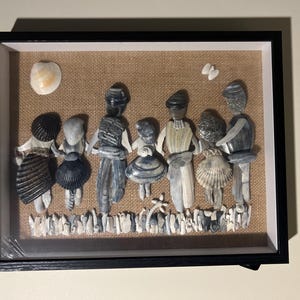 Arte Shadowbox di persone di conchiglie