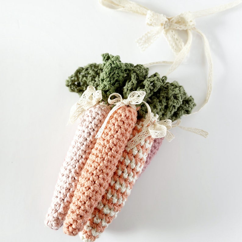 crochet carrots with green lacey tops in different colours for crochet carrot pattern
