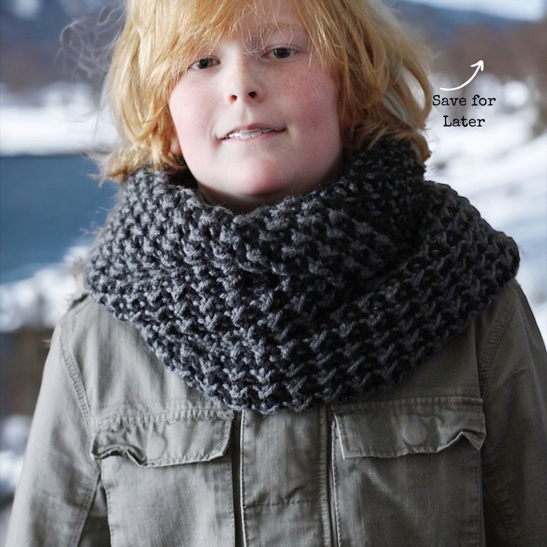 black and grey textured that looks like houndstooth crochet cowl on a boy