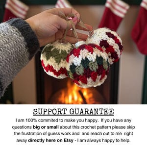 May include: Three handmade crochet Christmas ornaments in red, green, and white are held up against a fireplace. The ornaments have silver tops and are suspended by brown twine. The text at the bottom says "SUPPORT GUARANTEE".