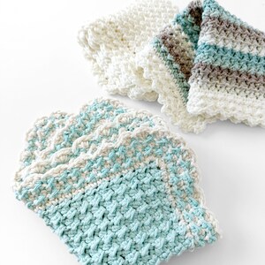 three crochet dishcloths made using the crochet crunch stitch clothes are in aqua cream and brown with a contrast border