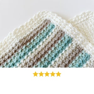 three crochet dishcloths made using the crochet crunch stitch clothes are in aqua cream and brown with a contrast border