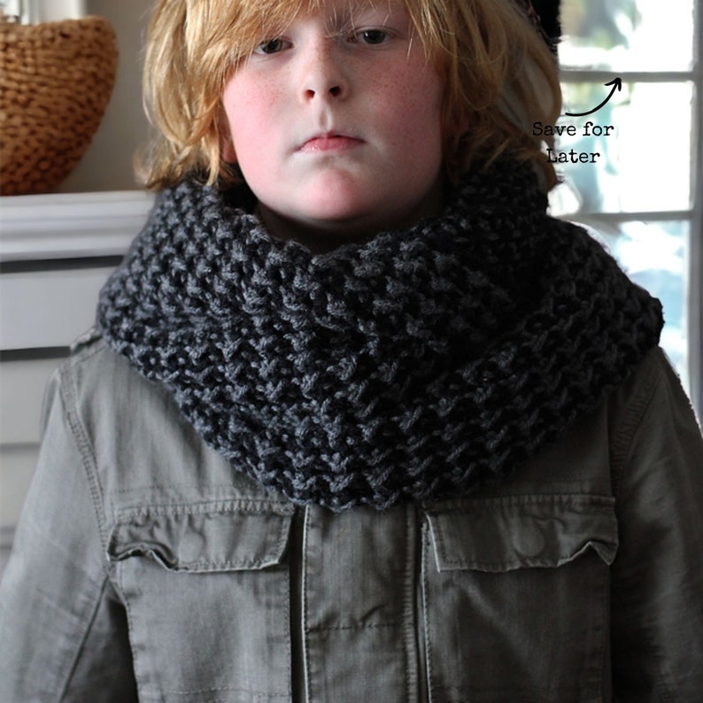 black and grey textured that looks like houndstooth crochet cowl on a boy