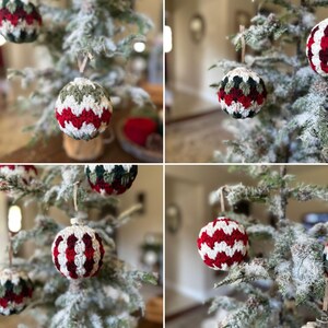 May include: Close-up of a Christmas tree adorned with handmade crochet ornaments. The ornaments feature a white base with red, green, and dark red zigzag patterns. Each ornament is suspended by a natural-colored string, adding a rustic touch to the festive decor.