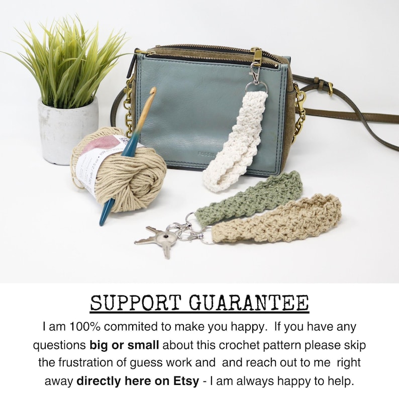 May include: A collection of handmade crochet keychains in white, green, and beige, displayed with a blue-green purse, yarn, and a crochet hook. The keychains are attached to silver key rings. A small potted plant is also in the image.