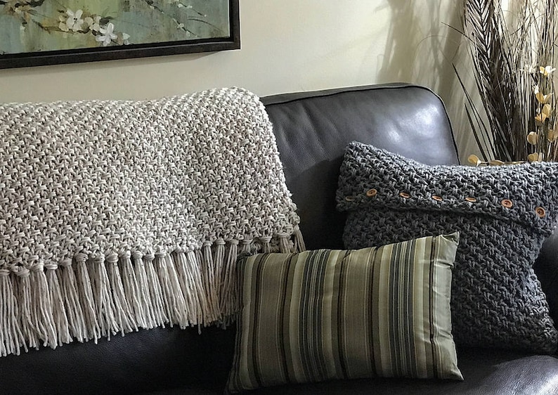 Beige crochet blanket with fringe that looks knit.  It is a throw size meaning it will cover legs and part of body not big enough for bed.  This is a crochet pattern not a finished item.