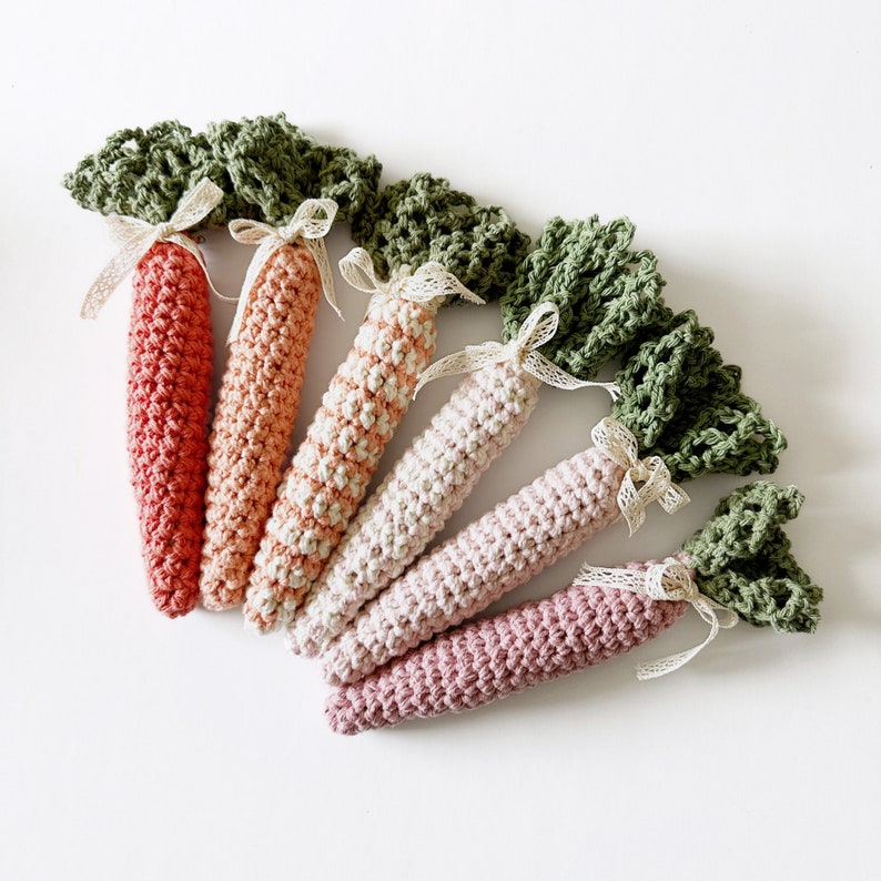 crochet carrots with green lacey tops in different colours for crochet carrot pattern