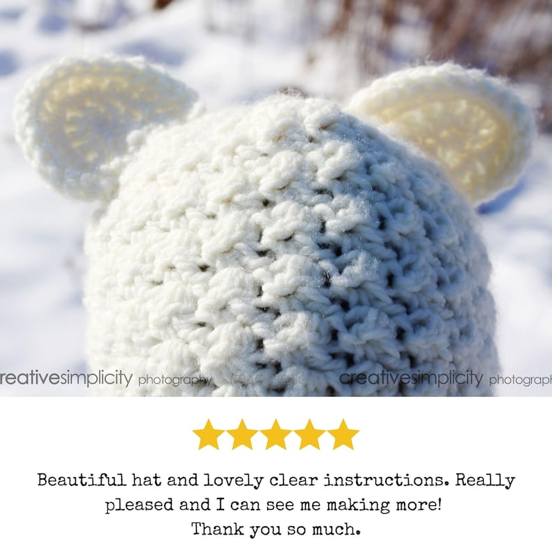 May include: White crocheted hat with bear ears. The hat is made with a textured stitch and is shown against a snowy background.