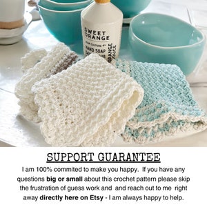 three crochet dishcloths made using the crochet crunch stitch clothes are in aqua cream and brown with a contrast border