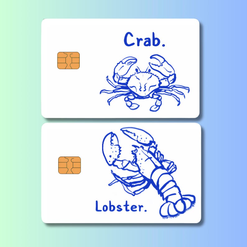 May include: Two white cards with blue illustrations of a crab and a lobster. The word "Crab" is above the crab illustration, and "Lobster" is below the lobster illustration. Each card has a gold-colored chip.