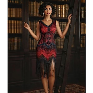 May include: A red and black flapper dress with fringe and beading. The dress has a V-neckline and a sleeveless design.