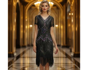 May include: A black sequined flapper dress with a fringe hem and a geometric pattern. The dress has a V-neckline and short sleeves.