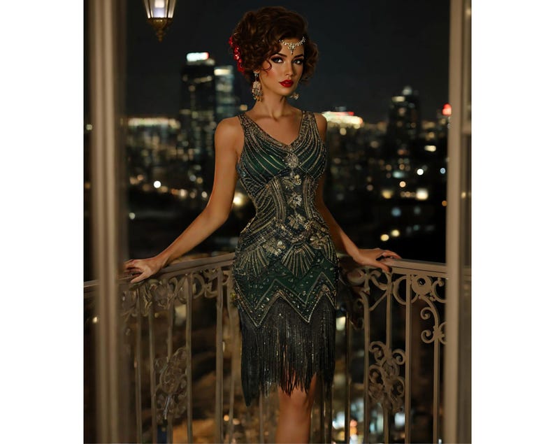 May include: A woman wearing a green and gold sequined flapper dress with fringe. The dress has a V-neckline and a fitted bodice. The woman is standing on a balcony with a city skyline in the background.