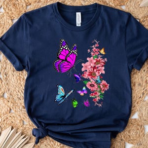Butterflies and Blossoms in Full Bloom: A Vibrant Floral Design on a Graphic T-Shirt for Nature Lovers