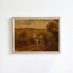 May include: A vintage oil painting depicting a rural scene with a white horse pulling a cart. A person in a dark coat is walking beside the horse. The painting is framed in a light wood frame.
