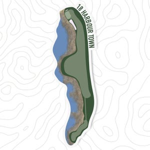 May include: A sticker featuring a golf course hole map. The design includes a green fairway, blue water, and a tan shoreline. The text "18 Harbour Town" is printed vertically on the right side of the sticker.