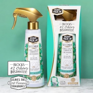May include: A white and green toilet odor eliminator spray bottle with a gold spray nozzle and matching box. The product is labelled "Instant Fresh Air" and "Seconda". The packaging states it blocks odours instantly and leaves a pleasant fragrance.