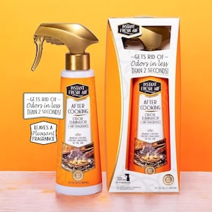 May include: An orange and white Instant Fresh Air odor eliminator spray bottle and box. The bottle has a gold spray nozzle and the box reads "After Cooking". Text on the bottle and box states it gets rid of odors in less than 2 seconds and leaves a pleasant fragrance. The bottle contains 10.1 fl oz (300 ml).