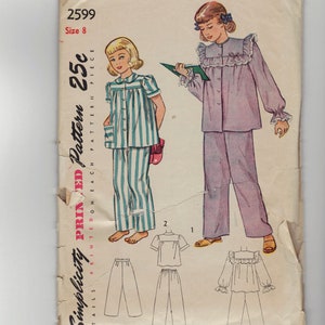 May include: Vintage Simplicity printed pattern for children's pajamas. The pattern features illustrations of two girls wearing different pajama styles. The pattern includes the number 2599 and size 8. The price is 25 cents.