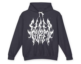 May include: A dark charcoal grey hooded sweatshirt featuring a white graphic print on the chest. The design consists of stylised, jagged, and dripping lettering that reads "STILL TUREN". The hoodie includes long sleeves, a front pocket, and white drawstrings.