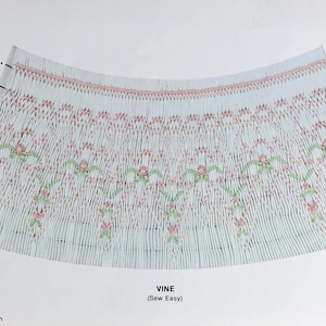 May include: A light blue fabric with a detailed smocked design. The design includes vertical lines and a floral pattern with pink and green accents. The word "VINE" is visible, along with the text "(Sew Easy)".