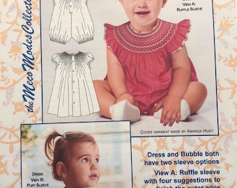May include: A sewing pattern for baby dresses and bubbles, featuring two children modeling the garments. The pattern includes options for ruffle or puffed sleeves, with sizes ranging from newborn to 24 months. The cover art is by Amanda Hunt.