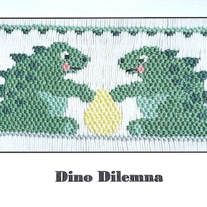 May include: Cross-stitch pattern featuring two green dinosaurs holding a yellow egg, with the text "Dino Dilemma" below. The dinosaurs have pink cheeks and are set against a white background with a decorative border.